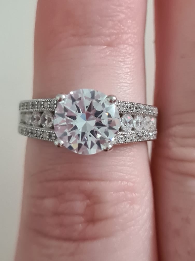 Engagement Style Simulated Diamond Ring set in sterling silver SIZE T