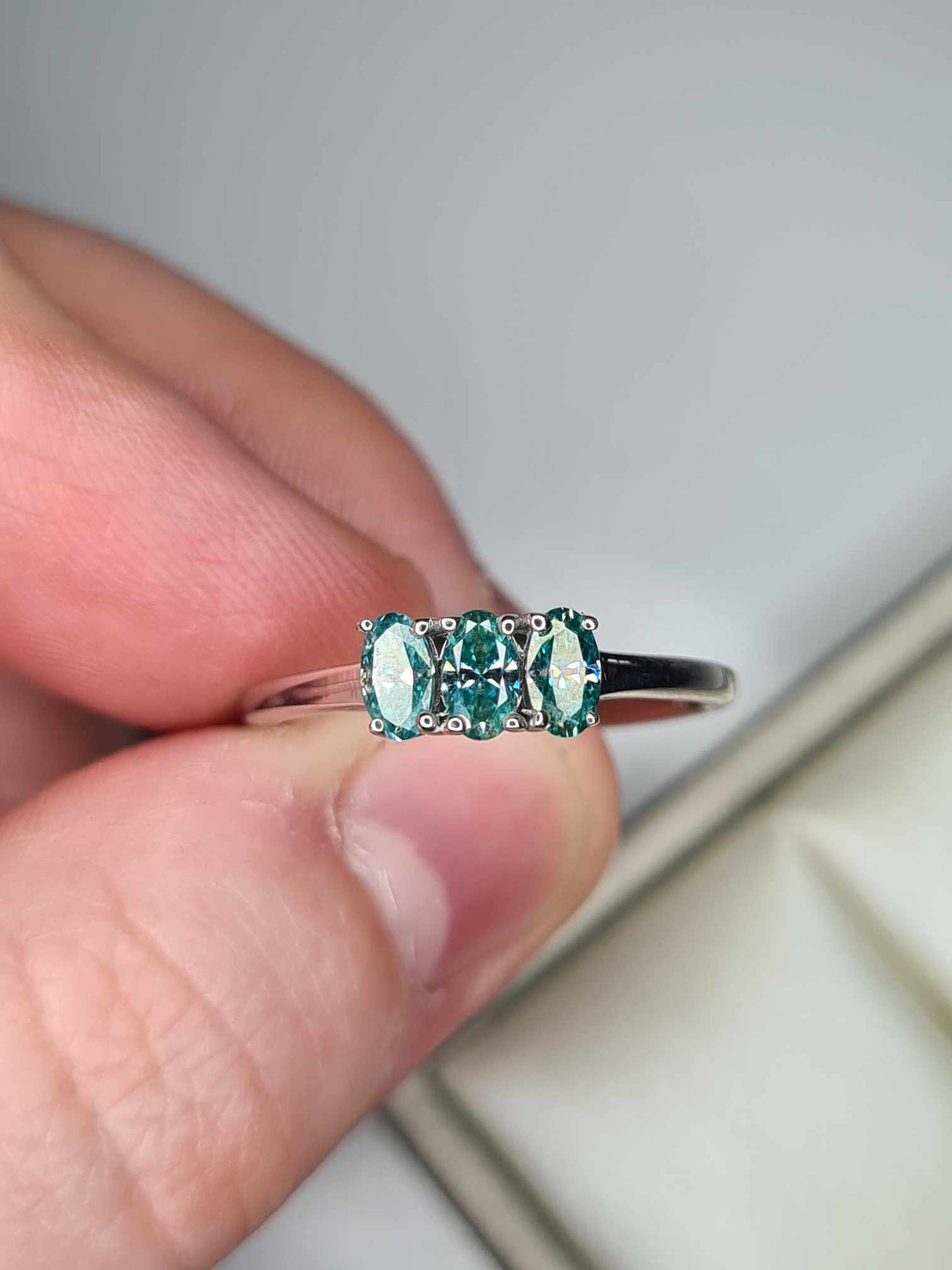 0.678ct Teal Blue Moissanite Trilogy Ring in Platinum Overlay 925 Sterling Silver