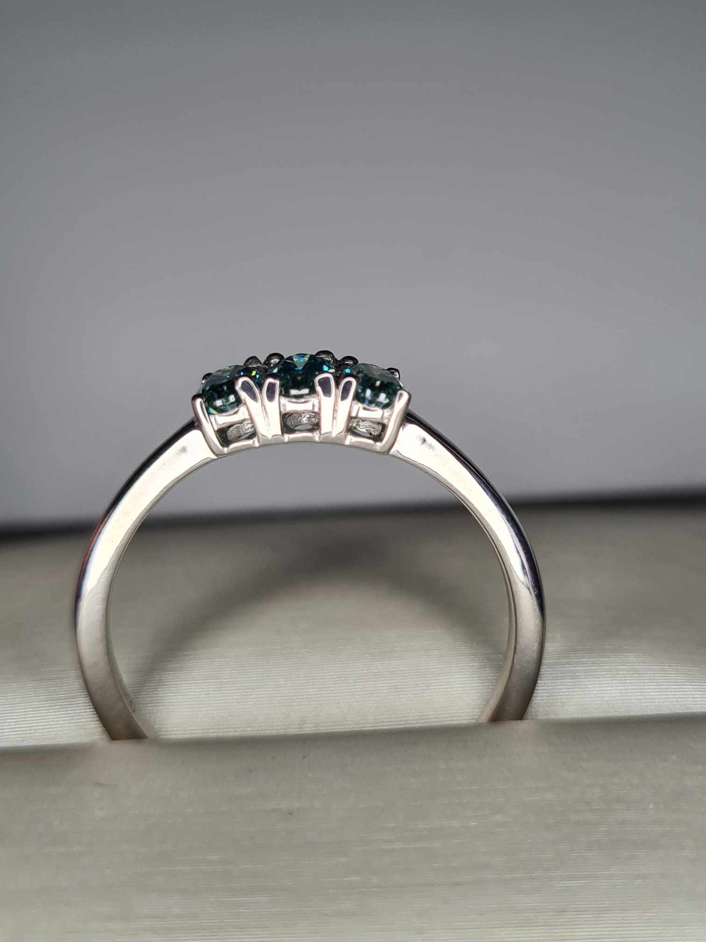 0.678ct Teal Blue Moissanite Trilogy Ring in Platinum Overlay 925 Sterling Silver